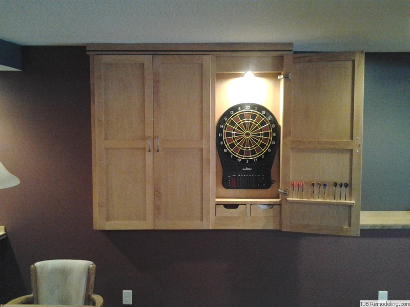 Darts game concealed by cabinets