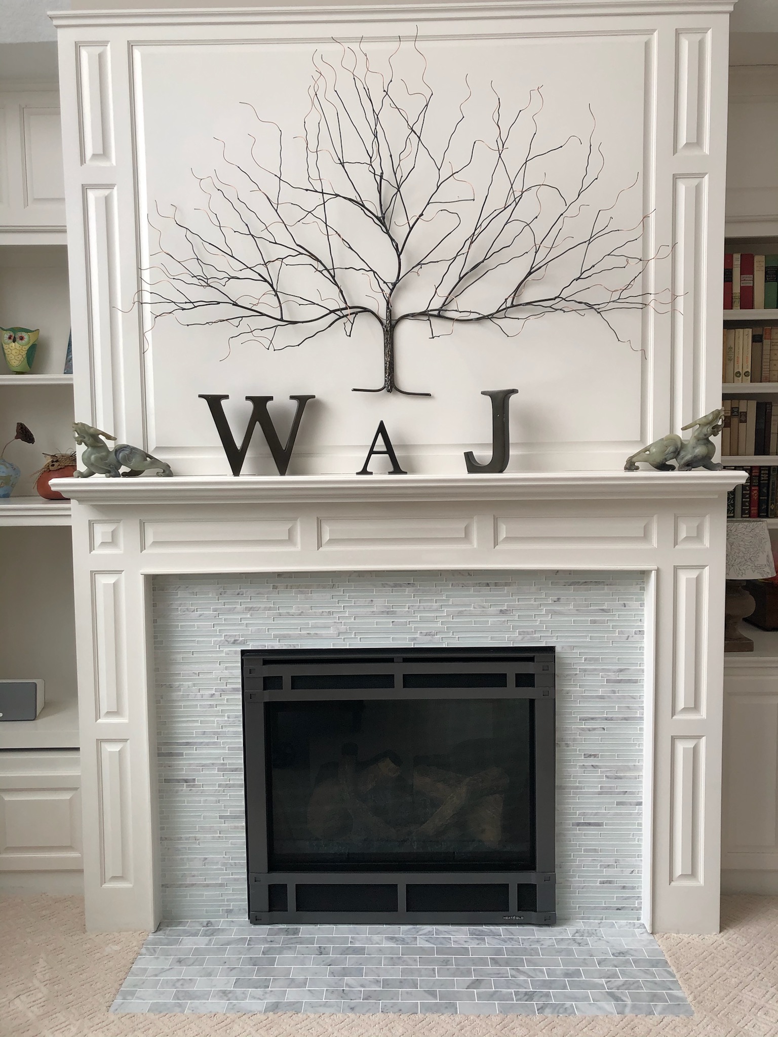 Fireplace with tile and wood surround