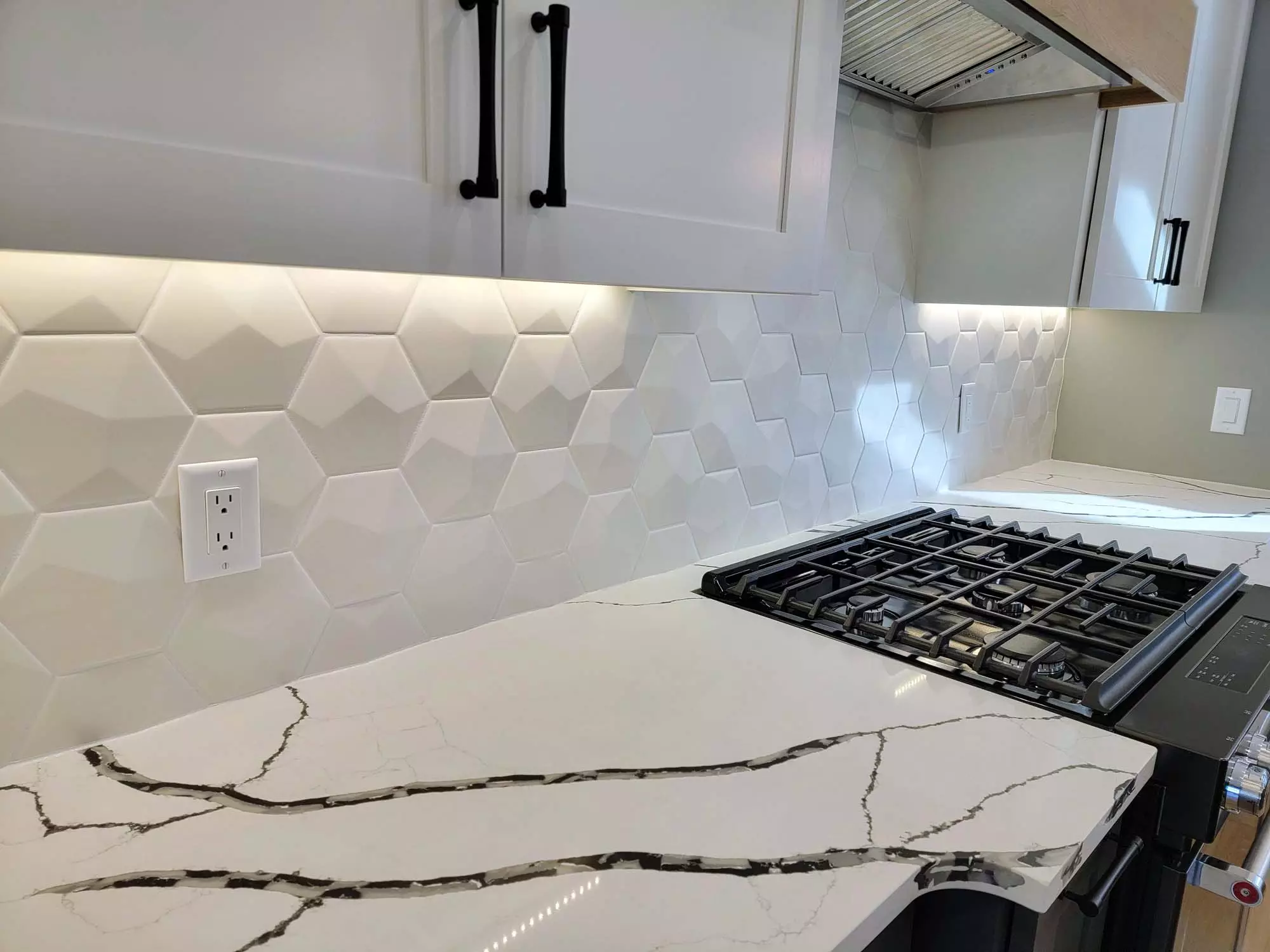 Quartz Counter tops w/ Geometric back splash tiles