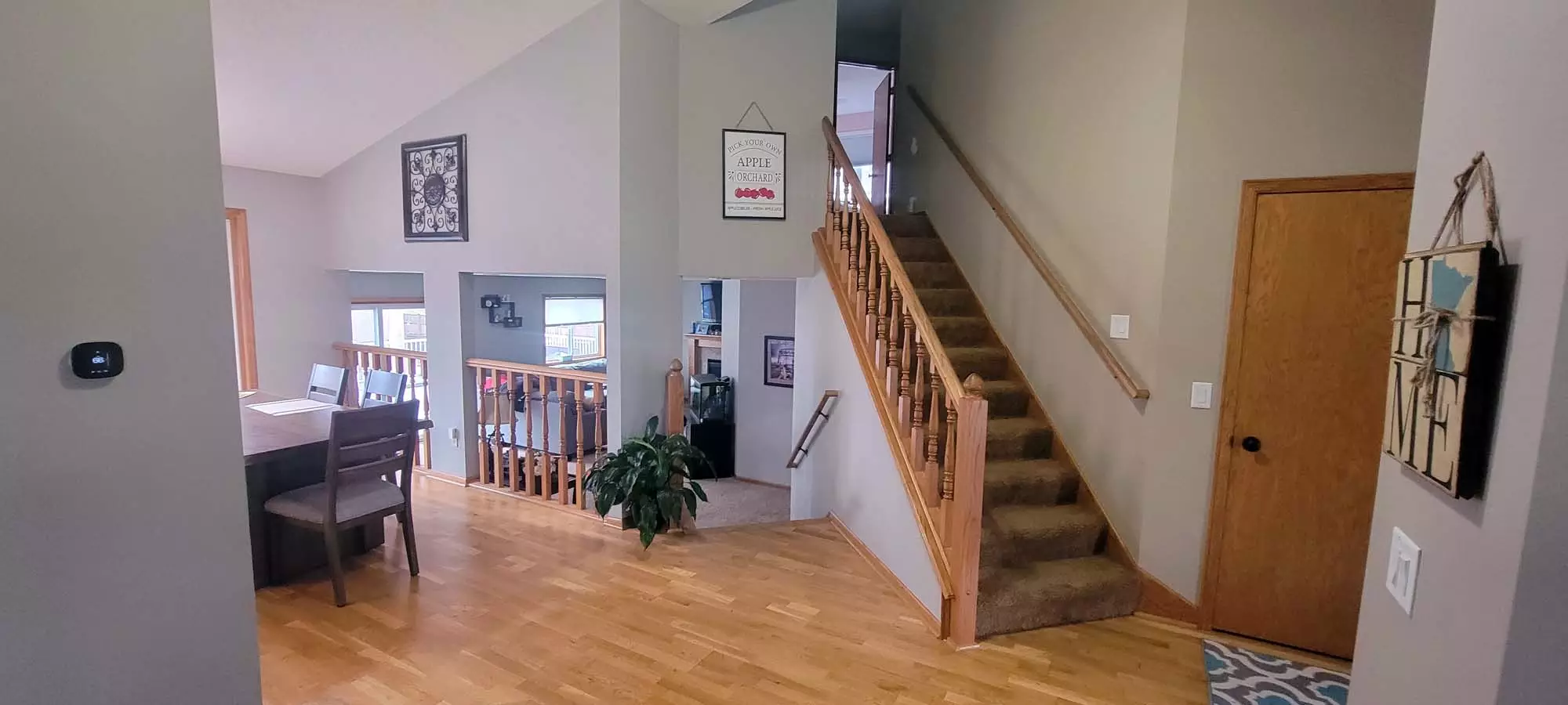 Andover Home Wood spindle railing to be updated to Wrought Iron railings