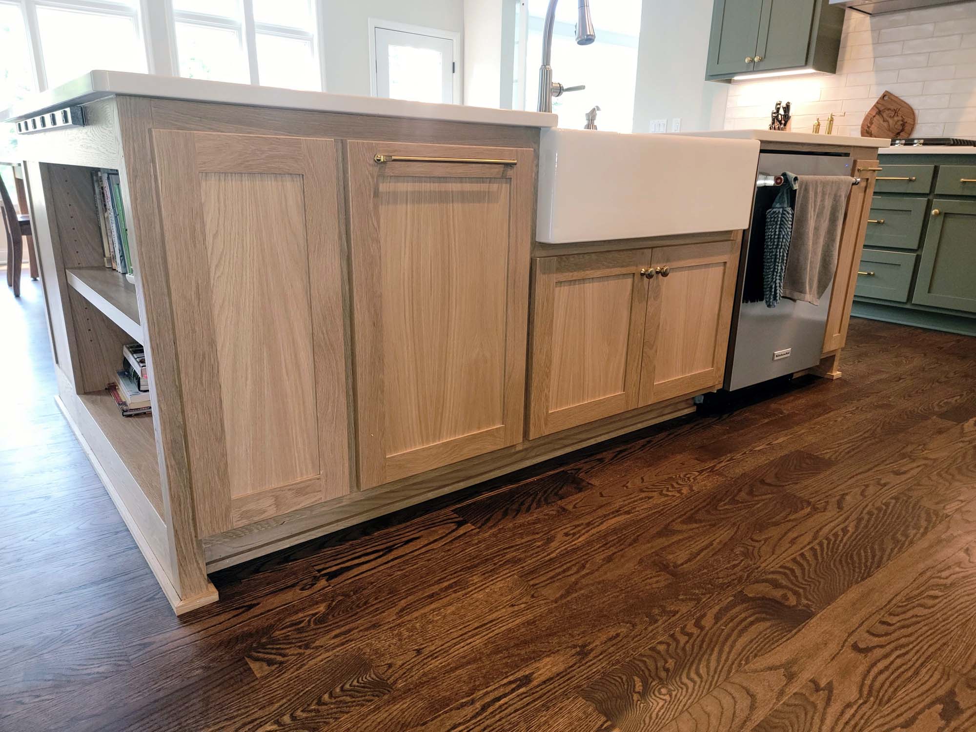 Nice contrast of wood floors with island cabinets