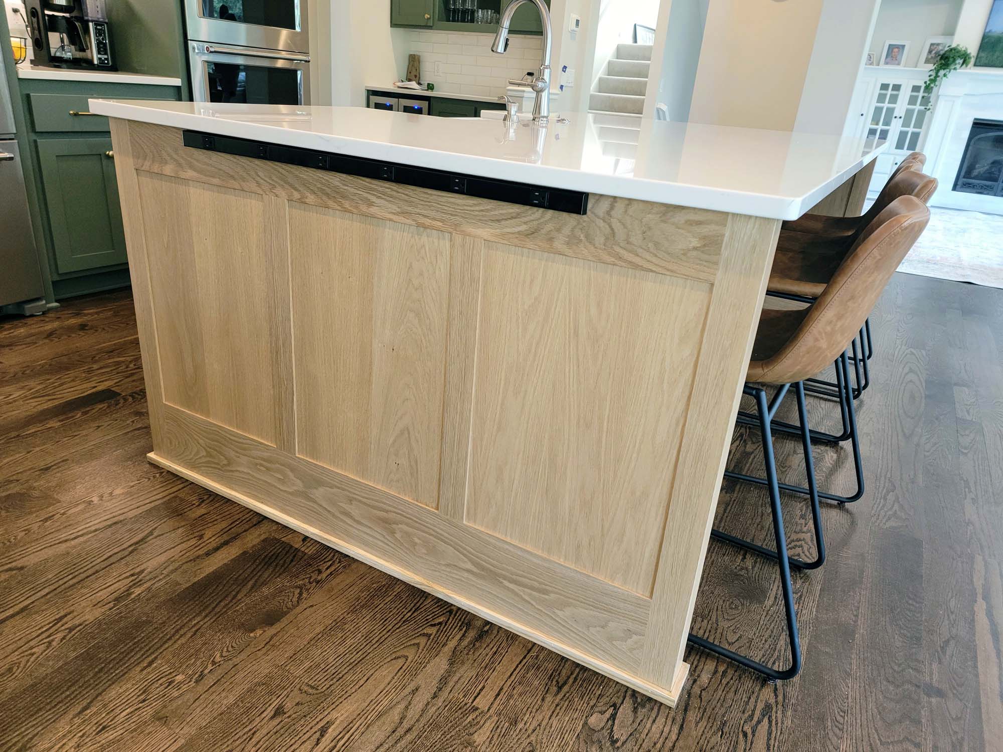 Kitchen island end panels with strip of outlets