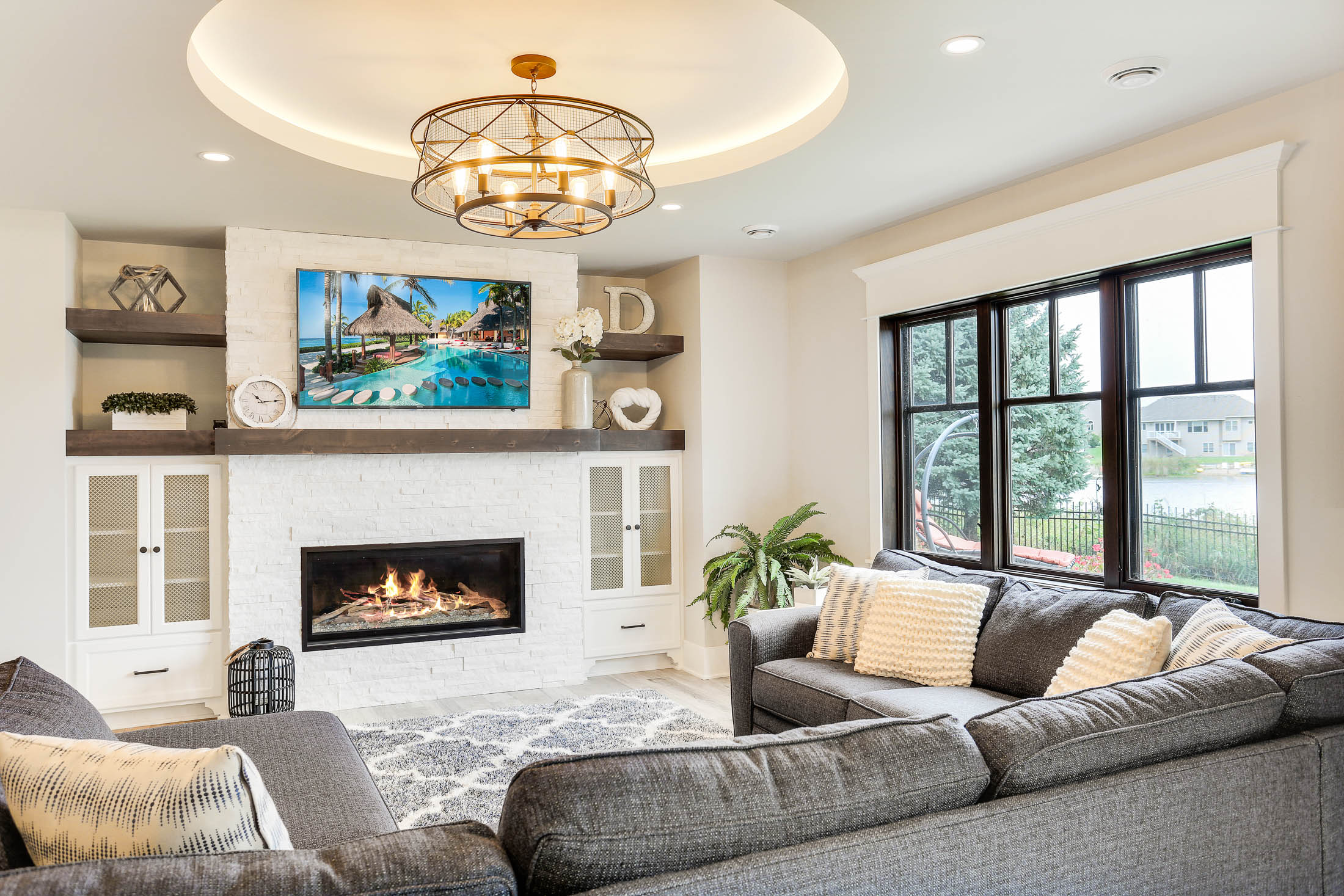 Relax by fireplace and enjoy lake views