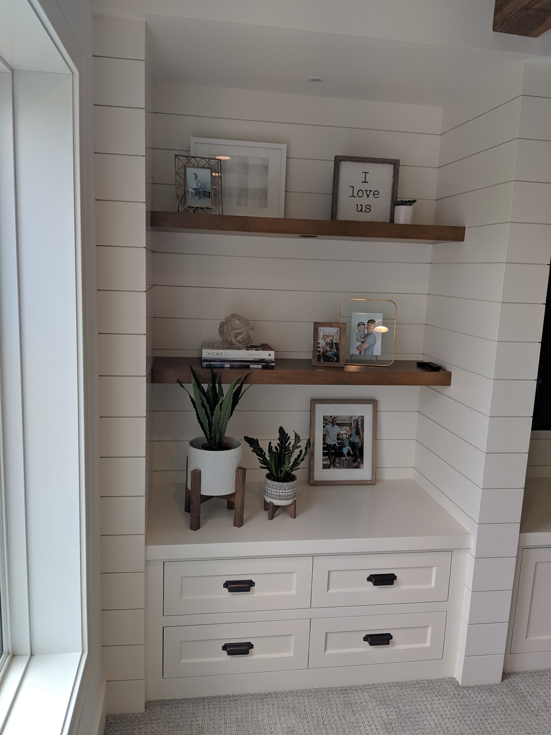 Inset craftsman custom enameled cabinets, floating shelves