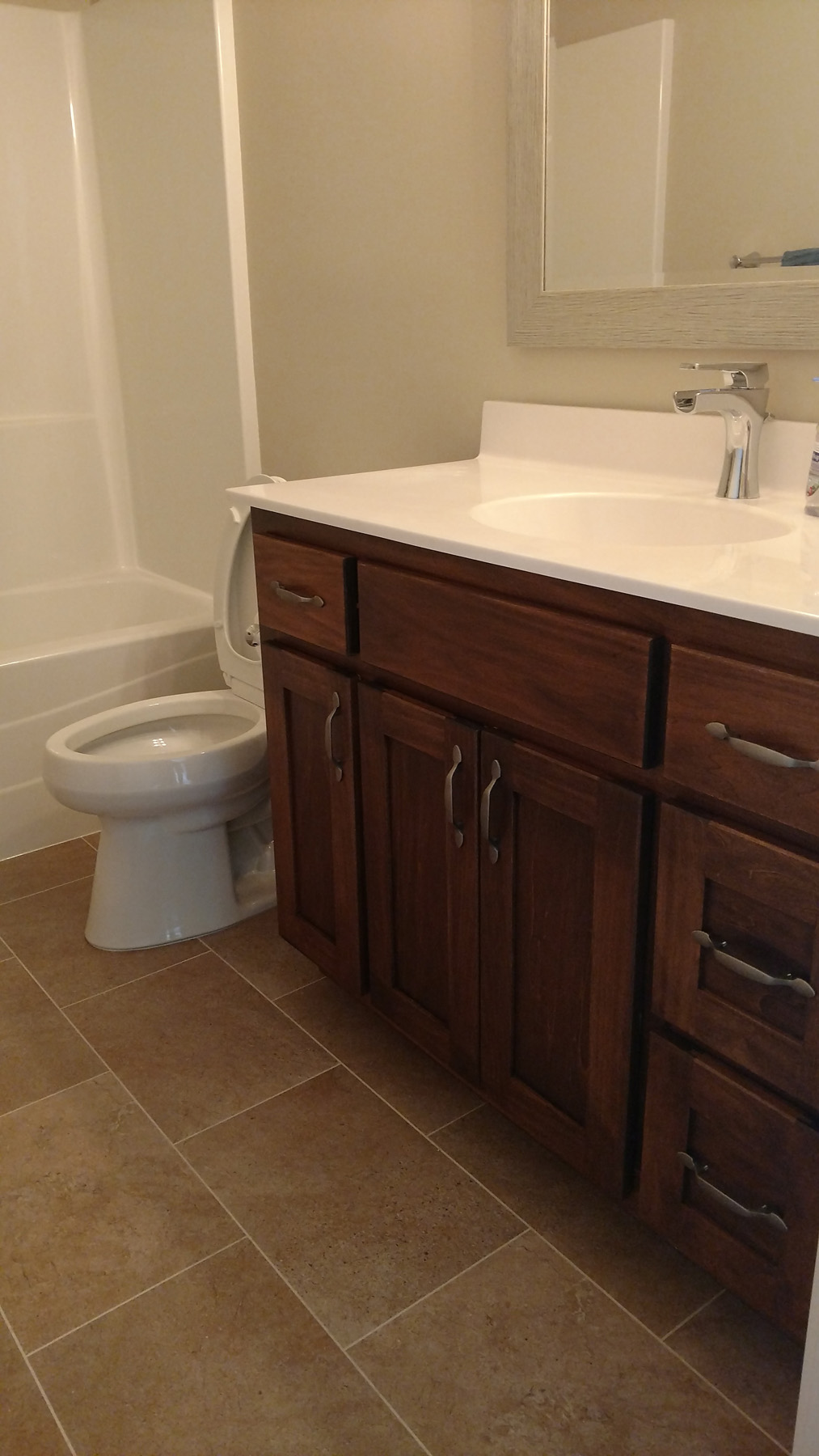 Bathroom with Knotty Alder Vanity Cabinets