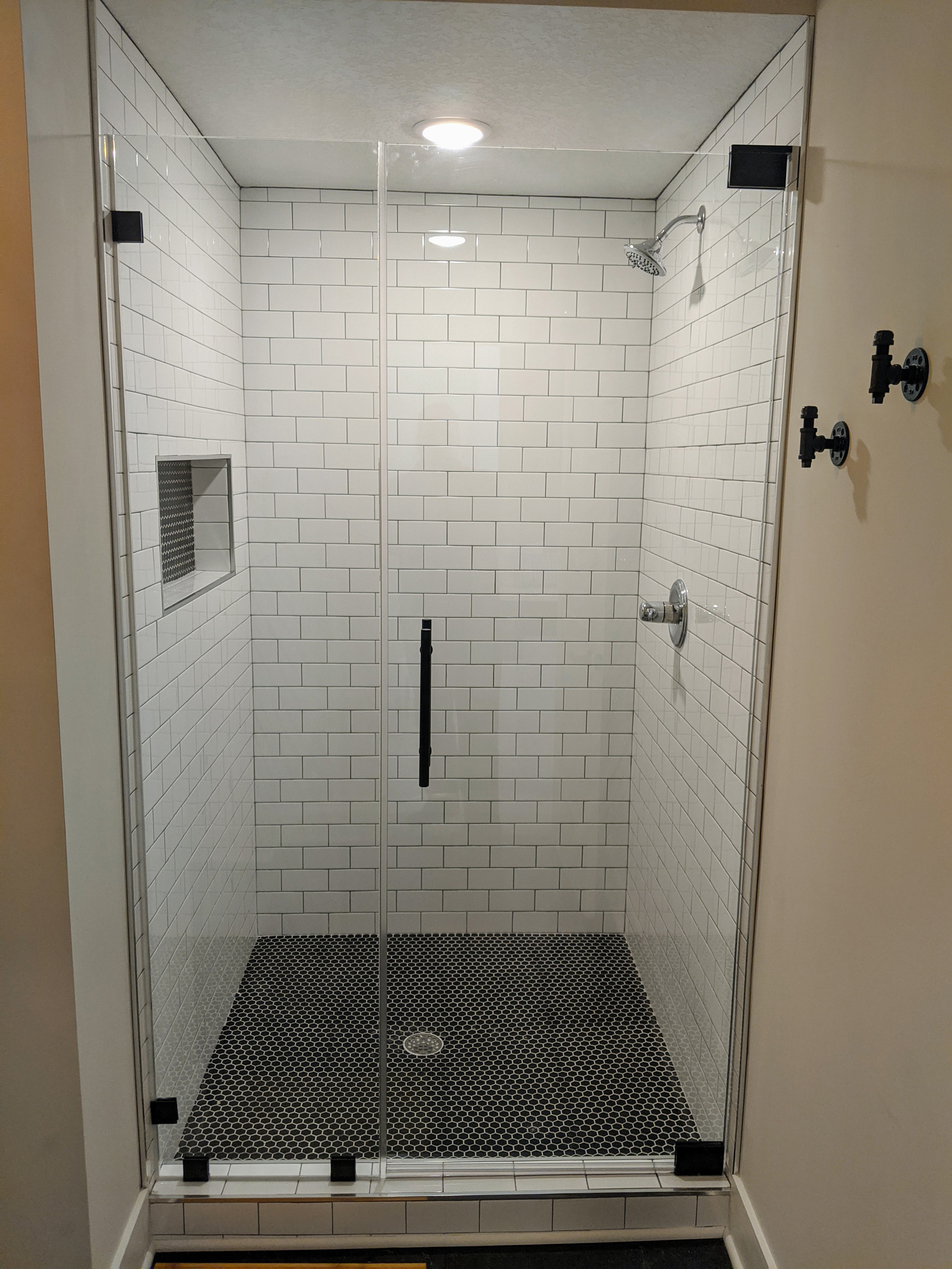 Timeless Subway tile shower w/ Black grout